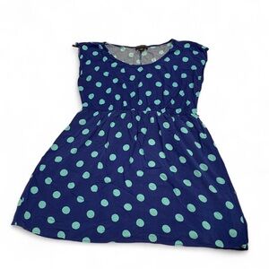 Navy blue polka dot dress with a touch of whimsy